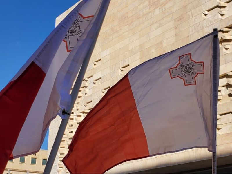 Citizens held Maltese flags in a protest in front of parliament on 22 June, 2020. 